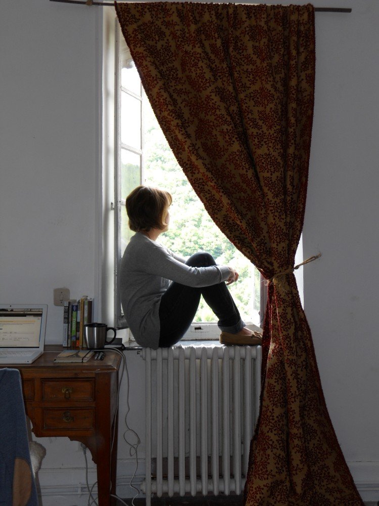 Playwright Nora Seilheimer sitting in Erato - La Muse